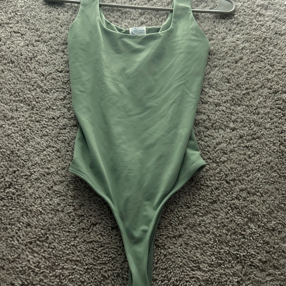 Green thong body suit